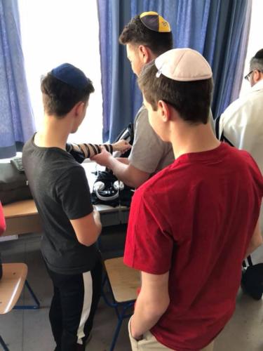 Putting on tefillin for the first time